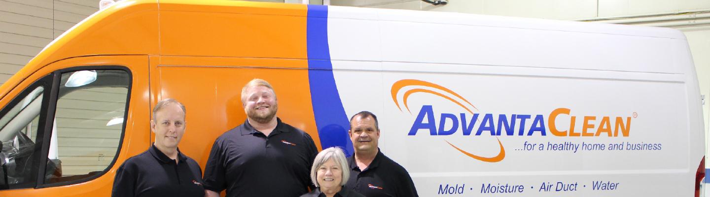 AdvantaClean team standing in front of their truck